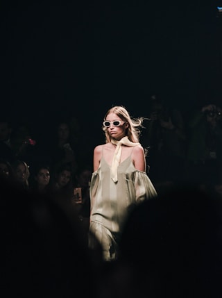 woman in white dress wearing sunglasses