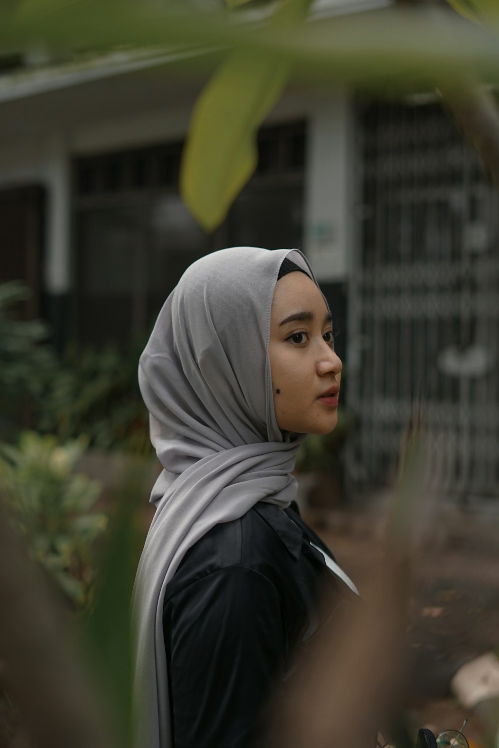 woman in white hijab and black jacket