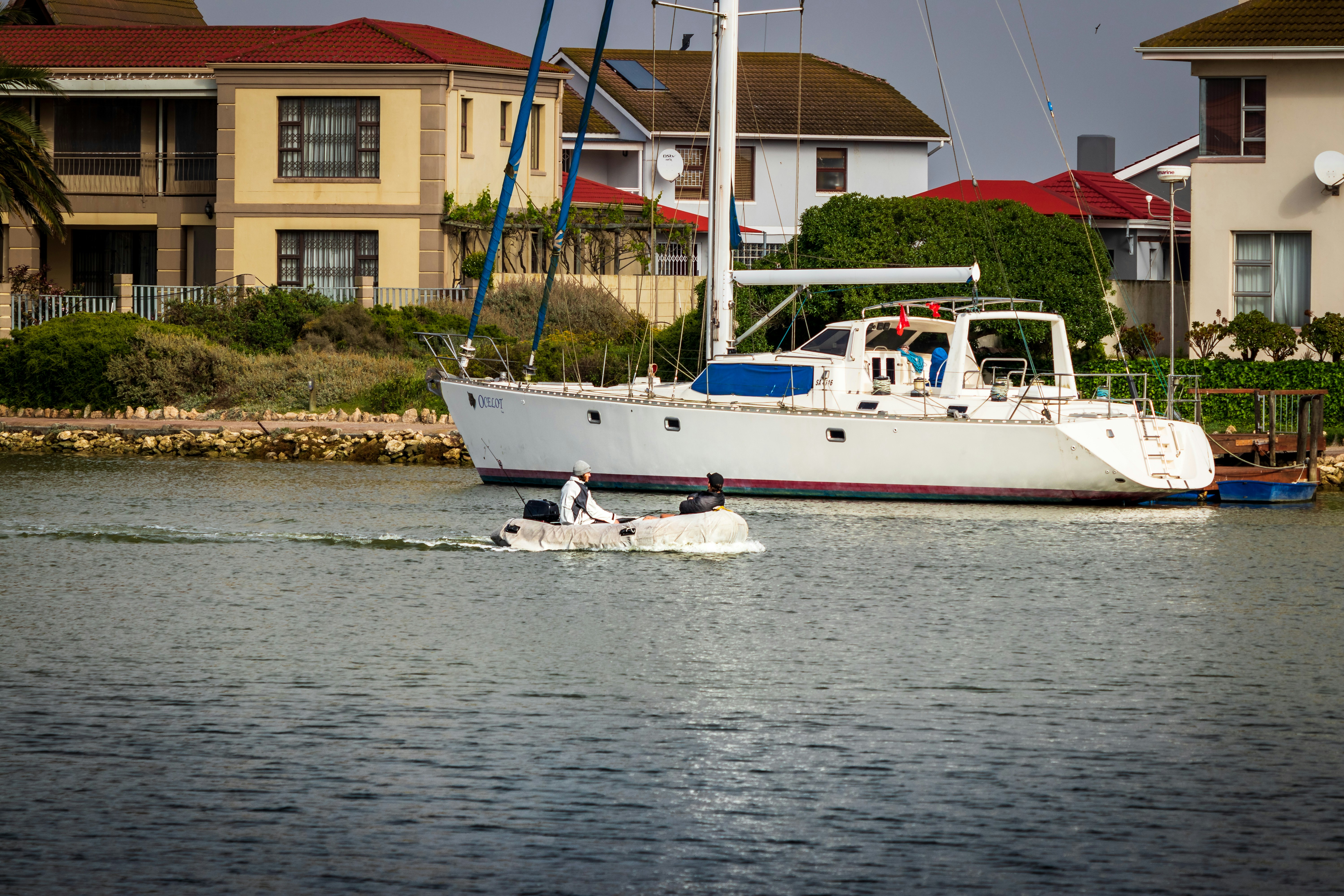 white and blue boat on sea during daytime