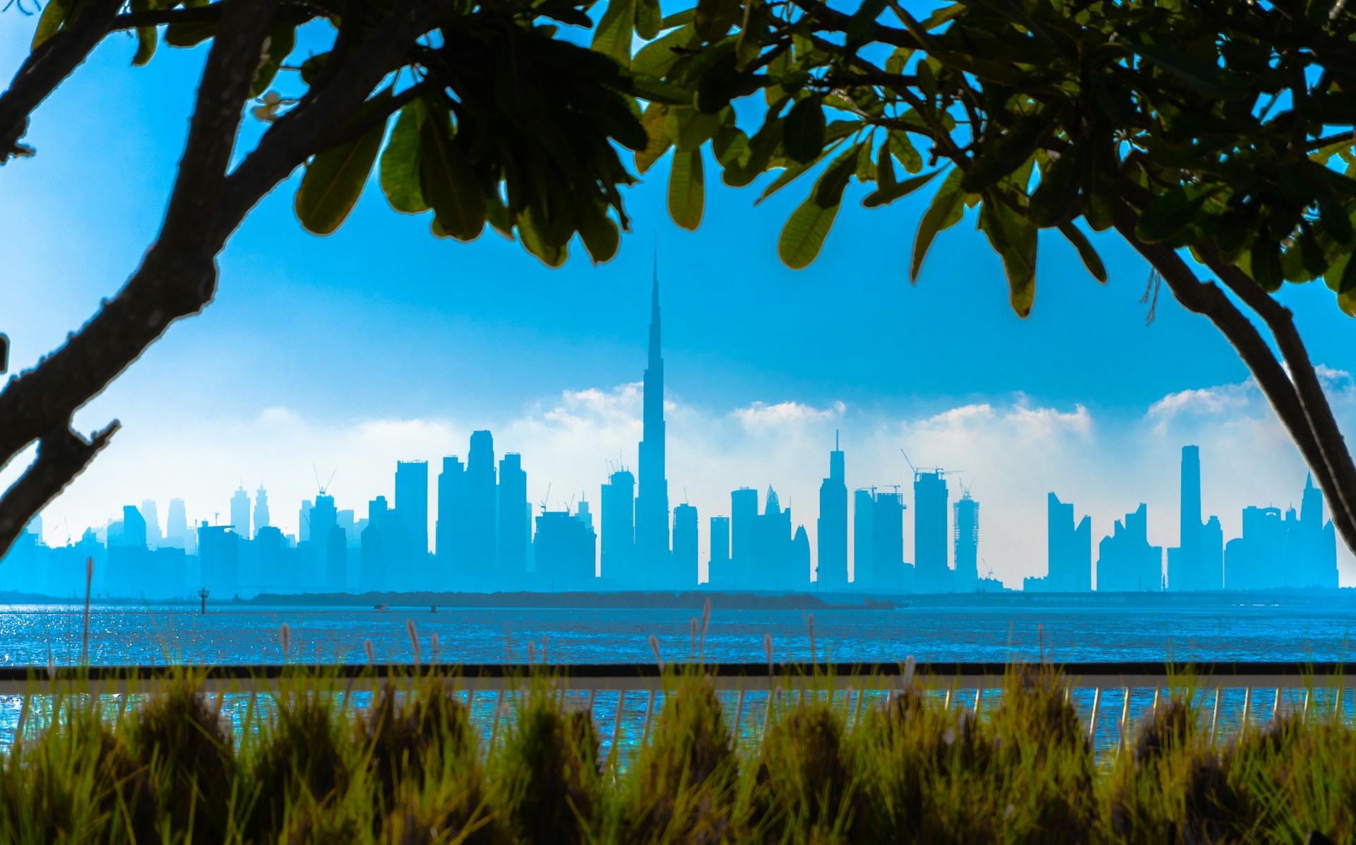 city skyline across body of water during daytime