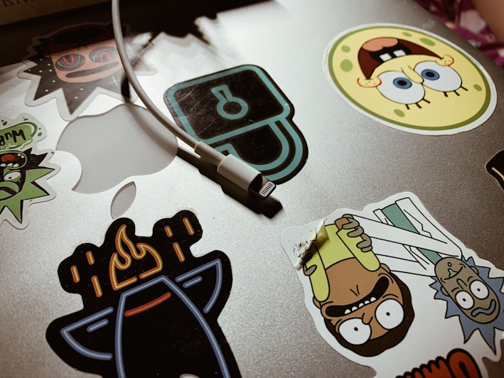 A colorful assortment of digital stickers displayed on a laptop screen