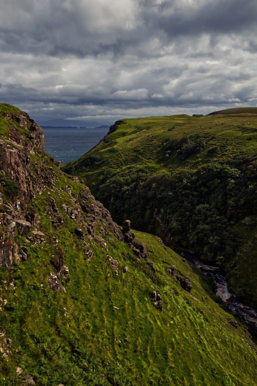 green and brown mountain under white clouds during daytime