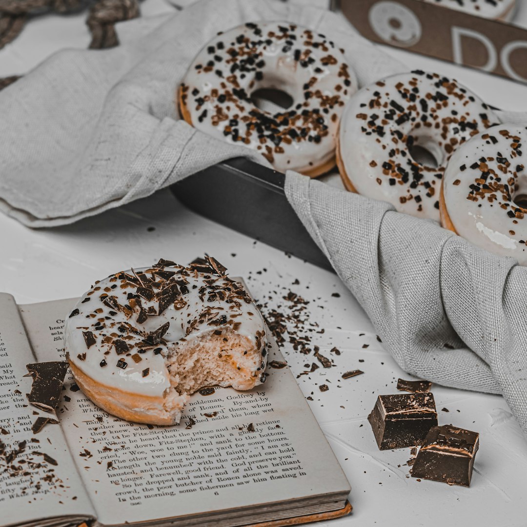 white and brown donut on white paper