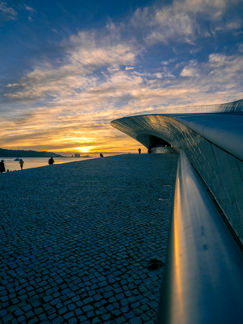 people on beach during sunset