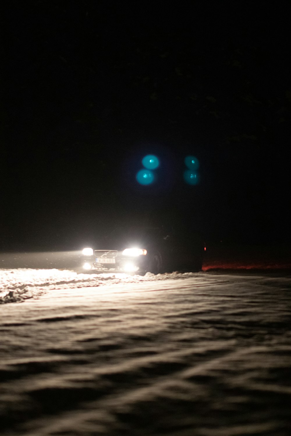 city lights on the beach during night time