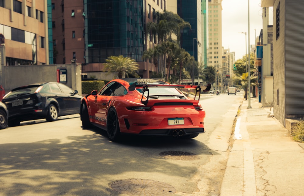 red porsche 911 on road during daytime