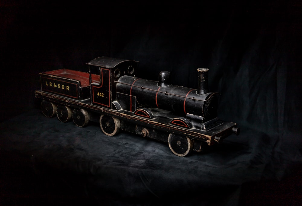 black and red train toy