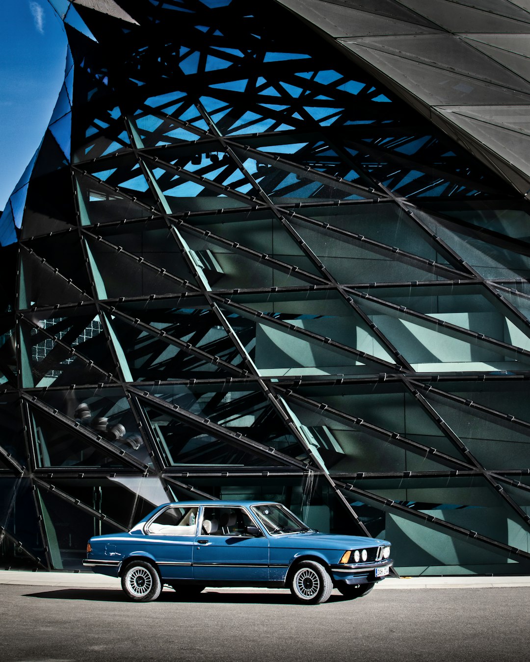 blue and white car on gray concrete road