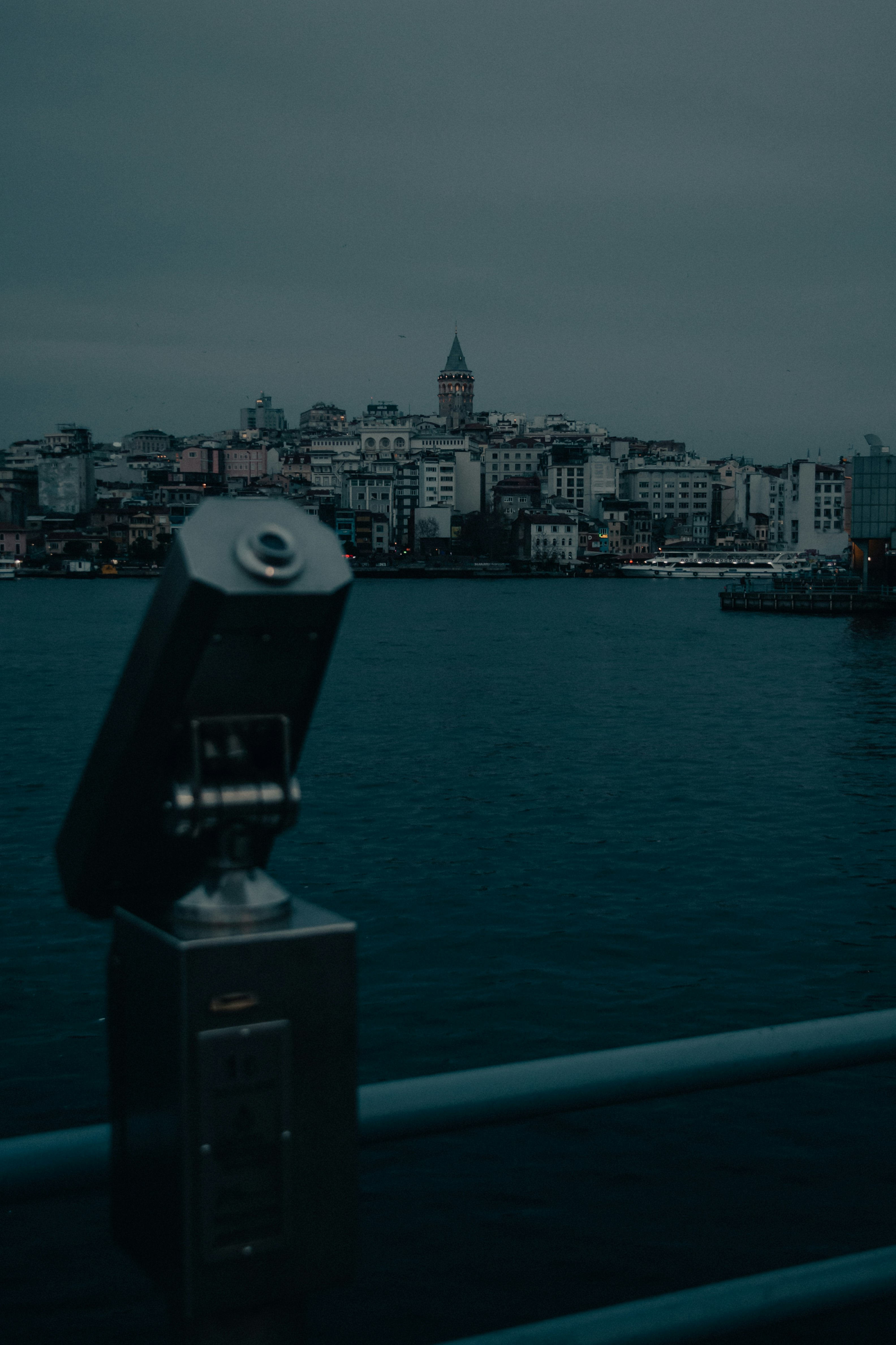 city skyline across body of water during daytime