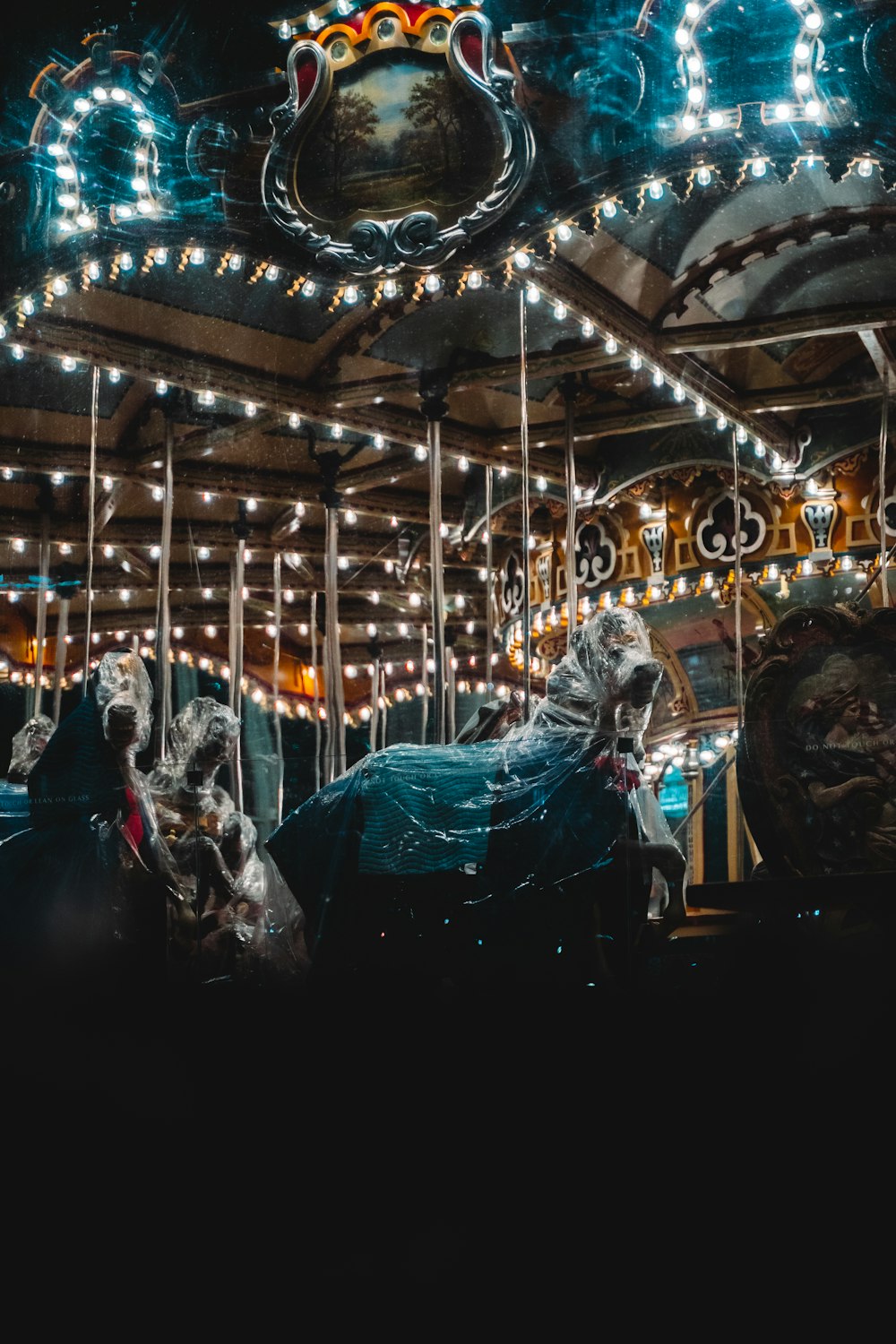 people riding on carousel during night time