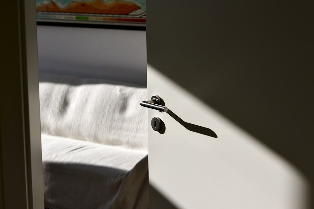 stainless steel faucet on white textile