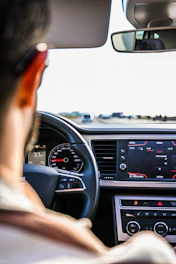 person driving car during daytime