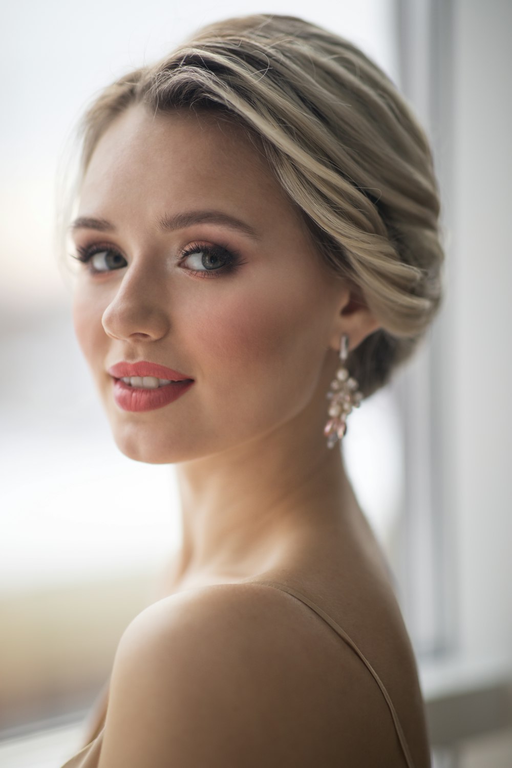 woman in white pearl earrings