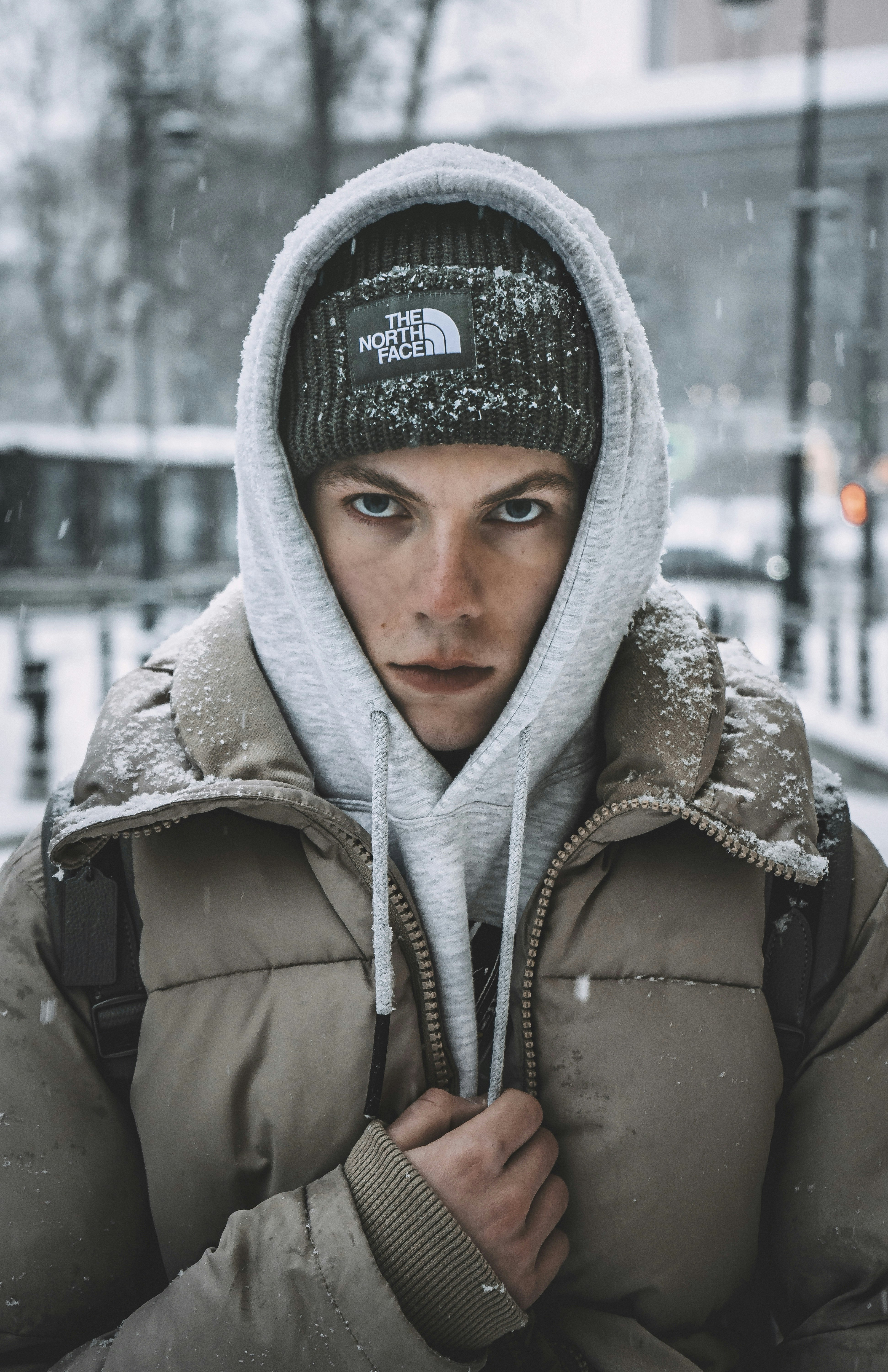 woman in gray hoodie wearing gray knit cap