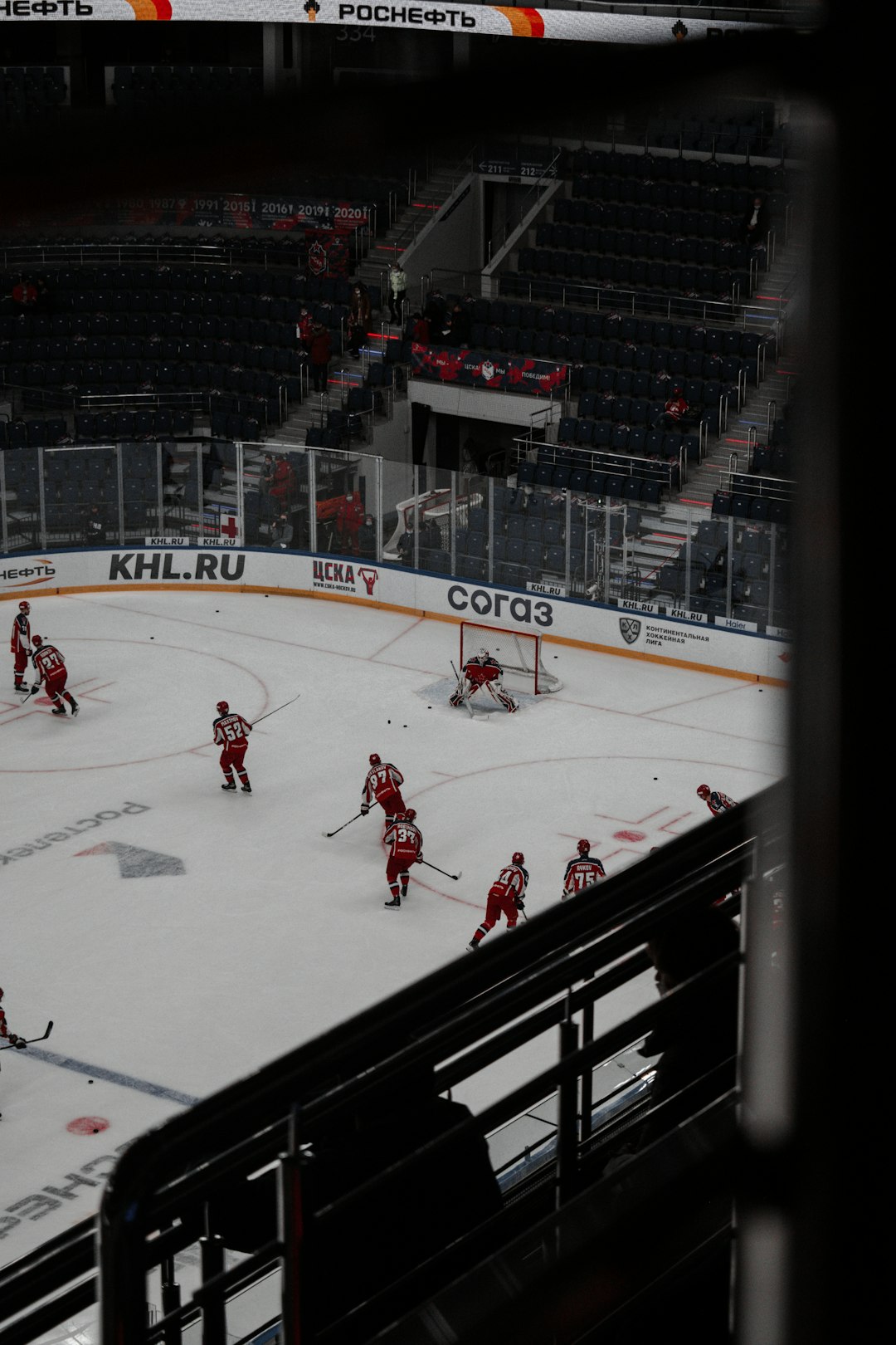 people playing ice hockey on ice field