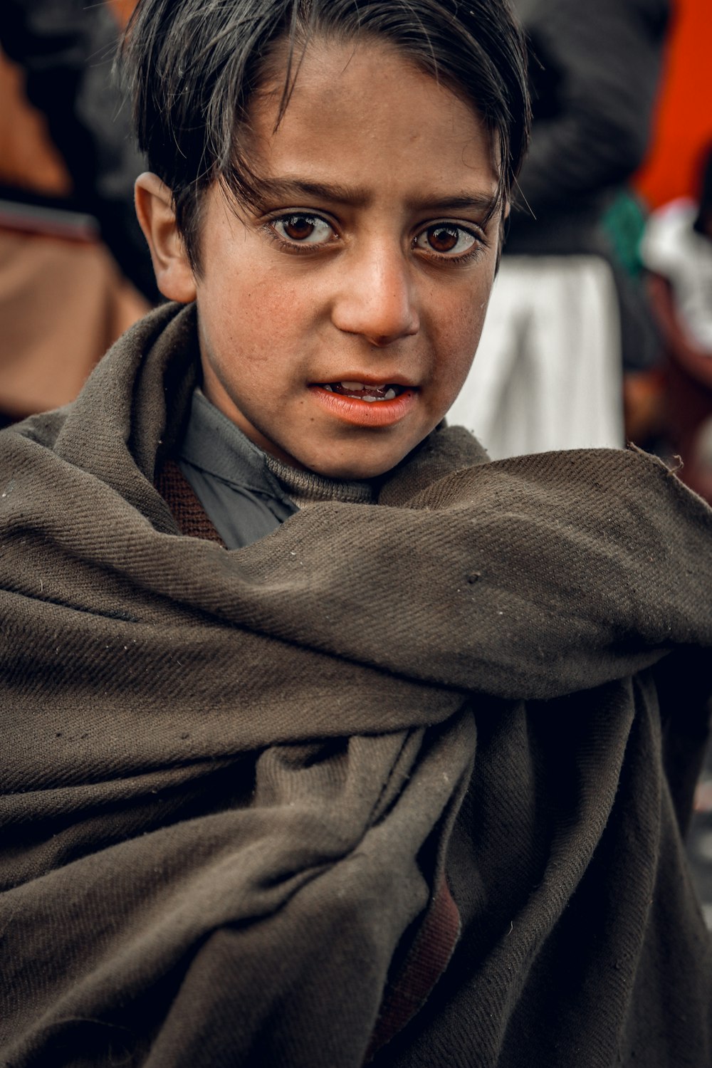 woman in gray scarf smiling