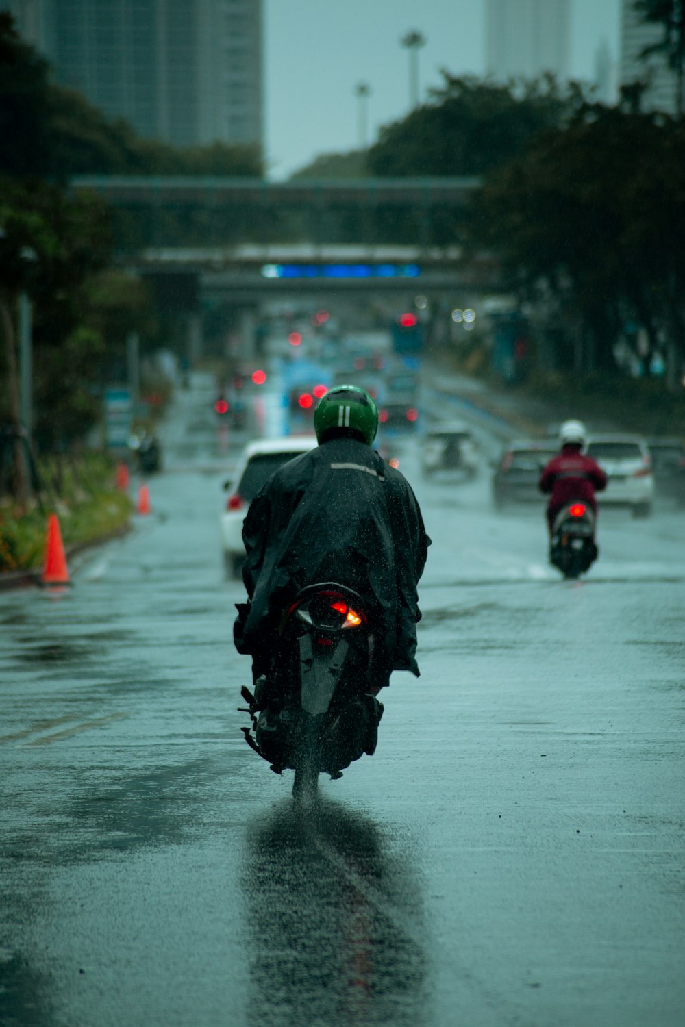 man in black jacket riding motorcycle on road during daytime