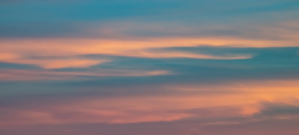 orange and blue cloudy sky during sunset