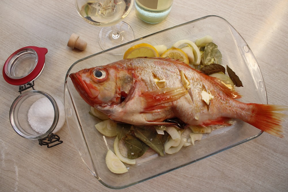 raw fish on white ceramic plate