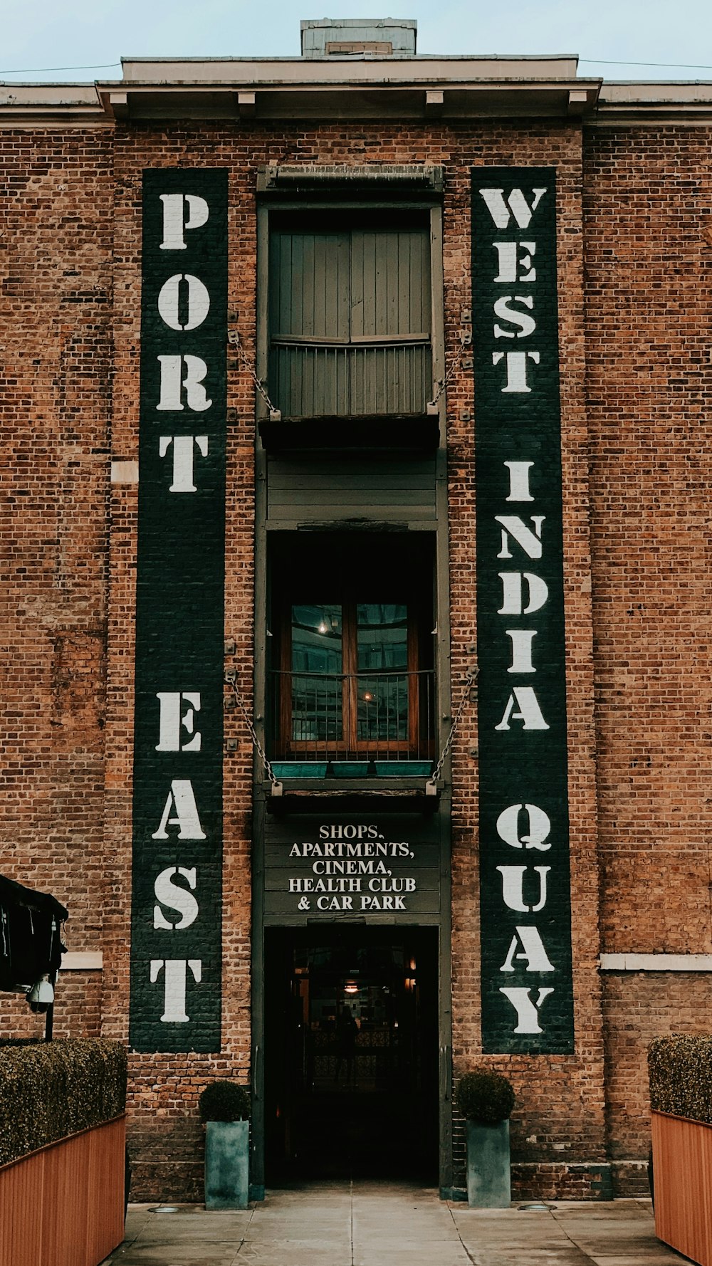 brown brick building with glass window