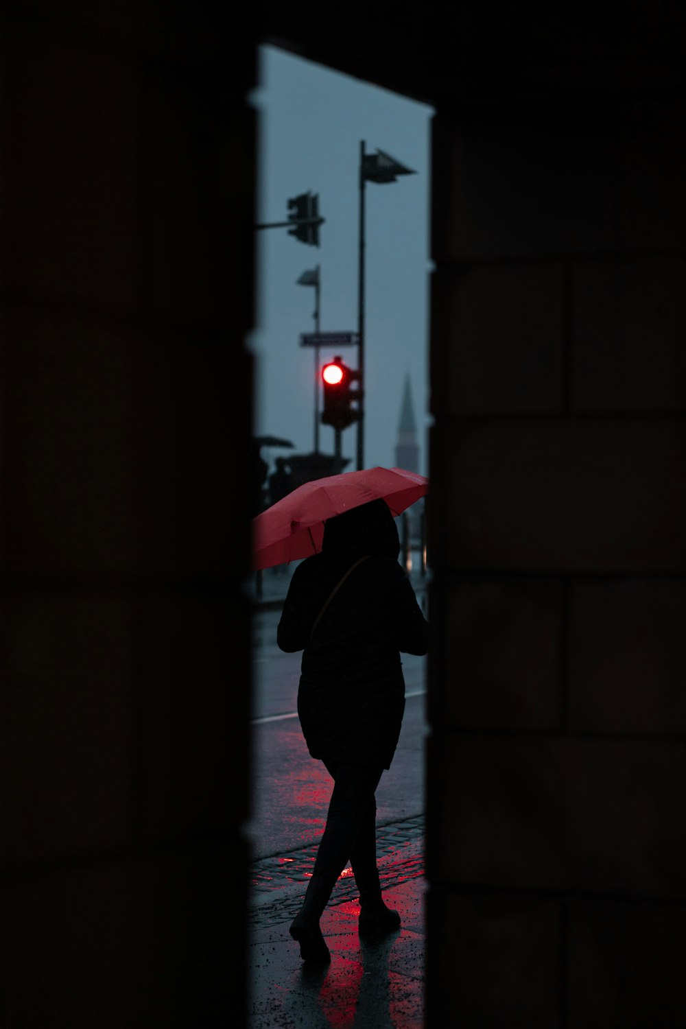 person in black jacket holding umbrella