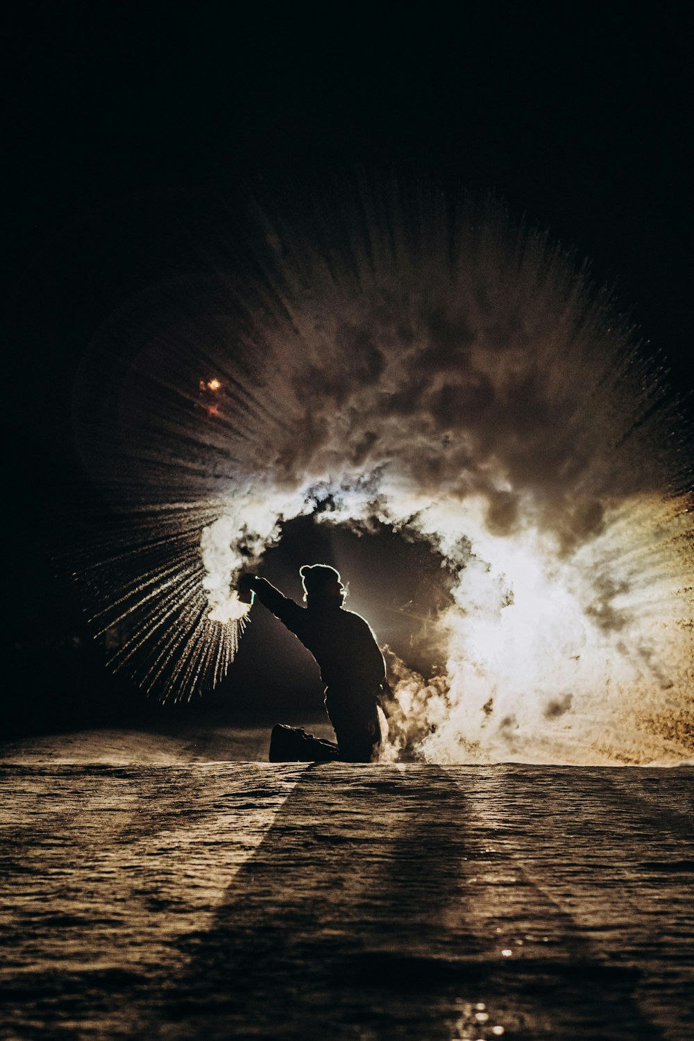 silhouette of man and woman kissing on beach shore during night time