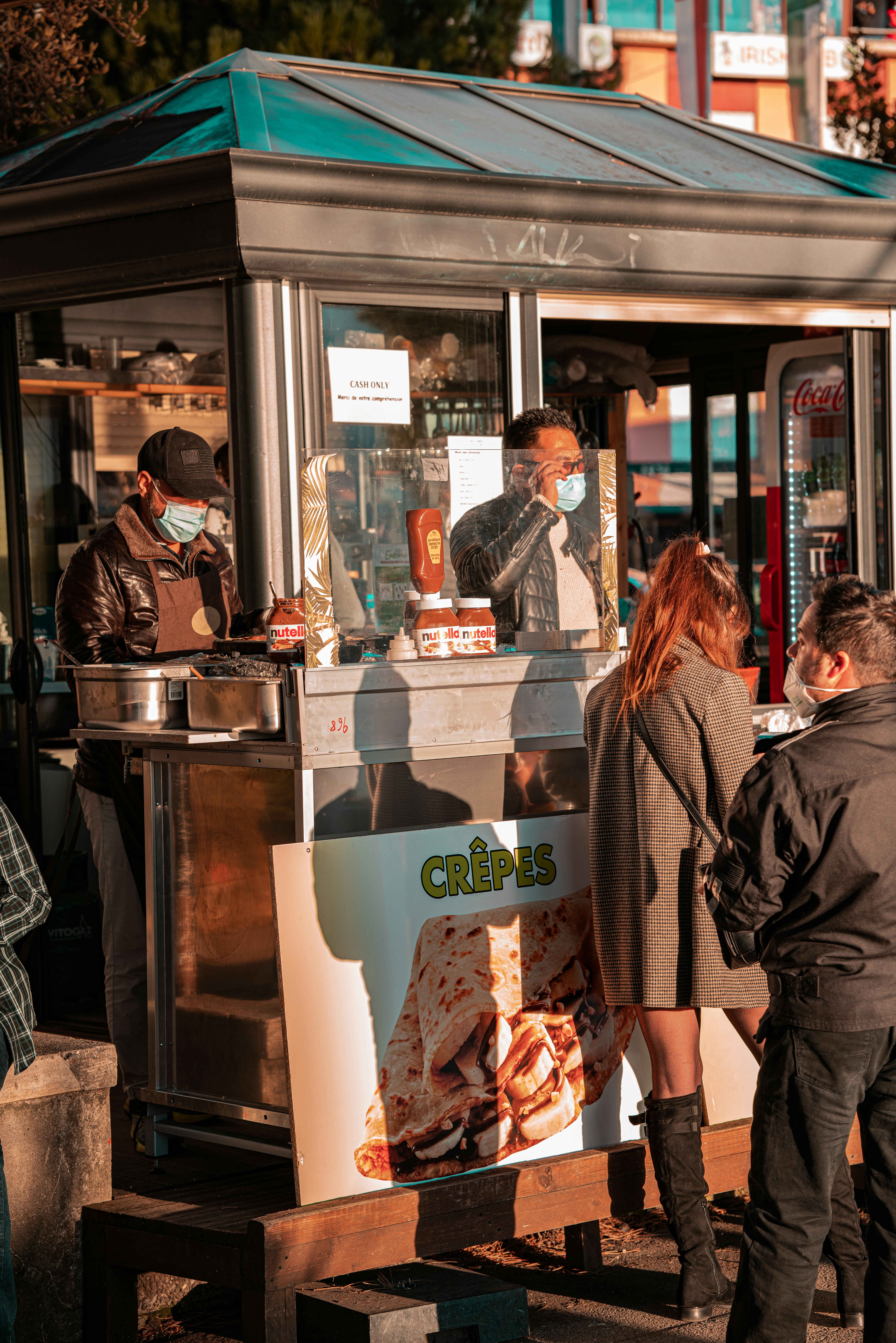 man in black leather jacket standing beside woman in black jacket