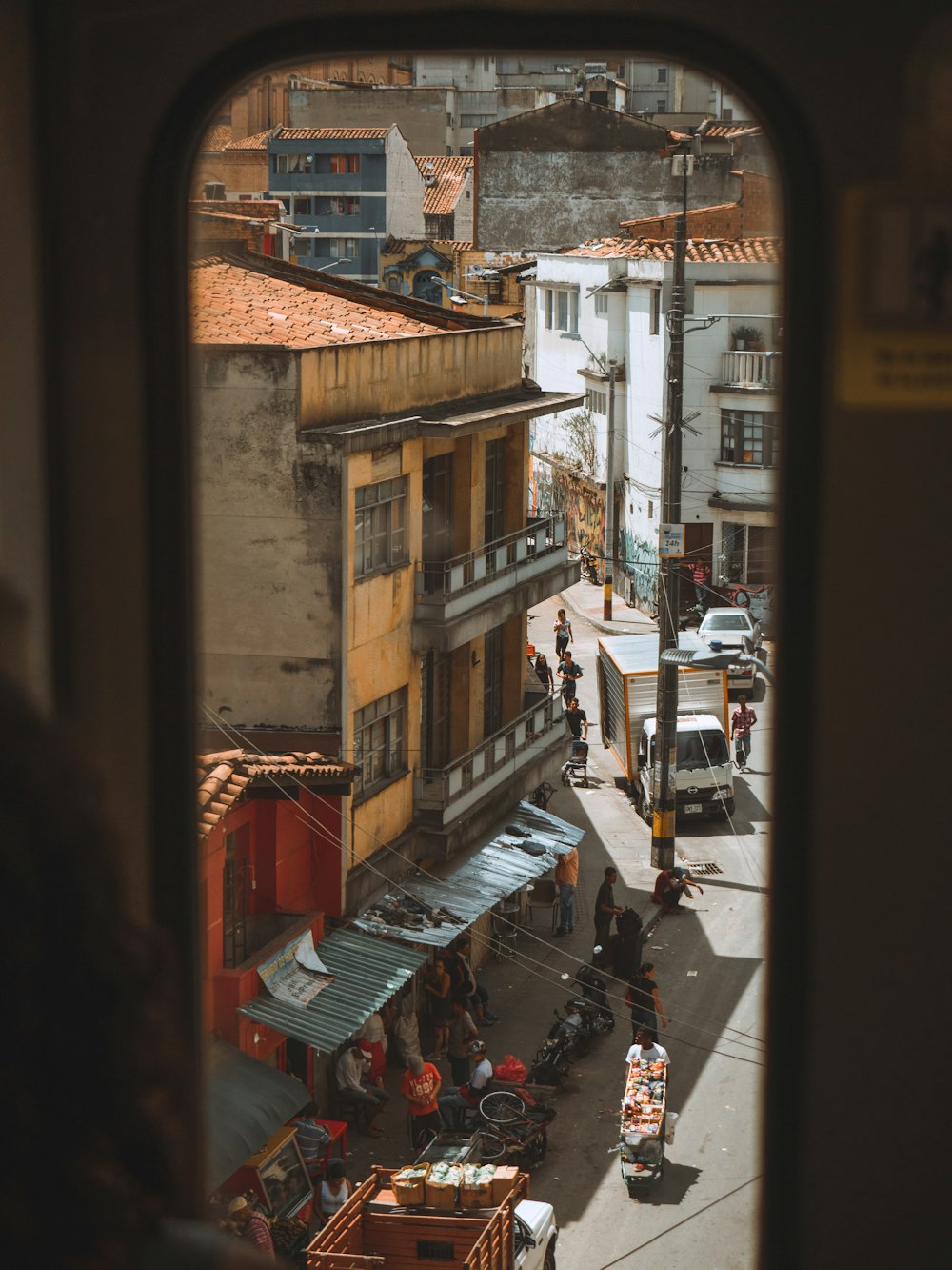 cars parked on street near buildings during daytime