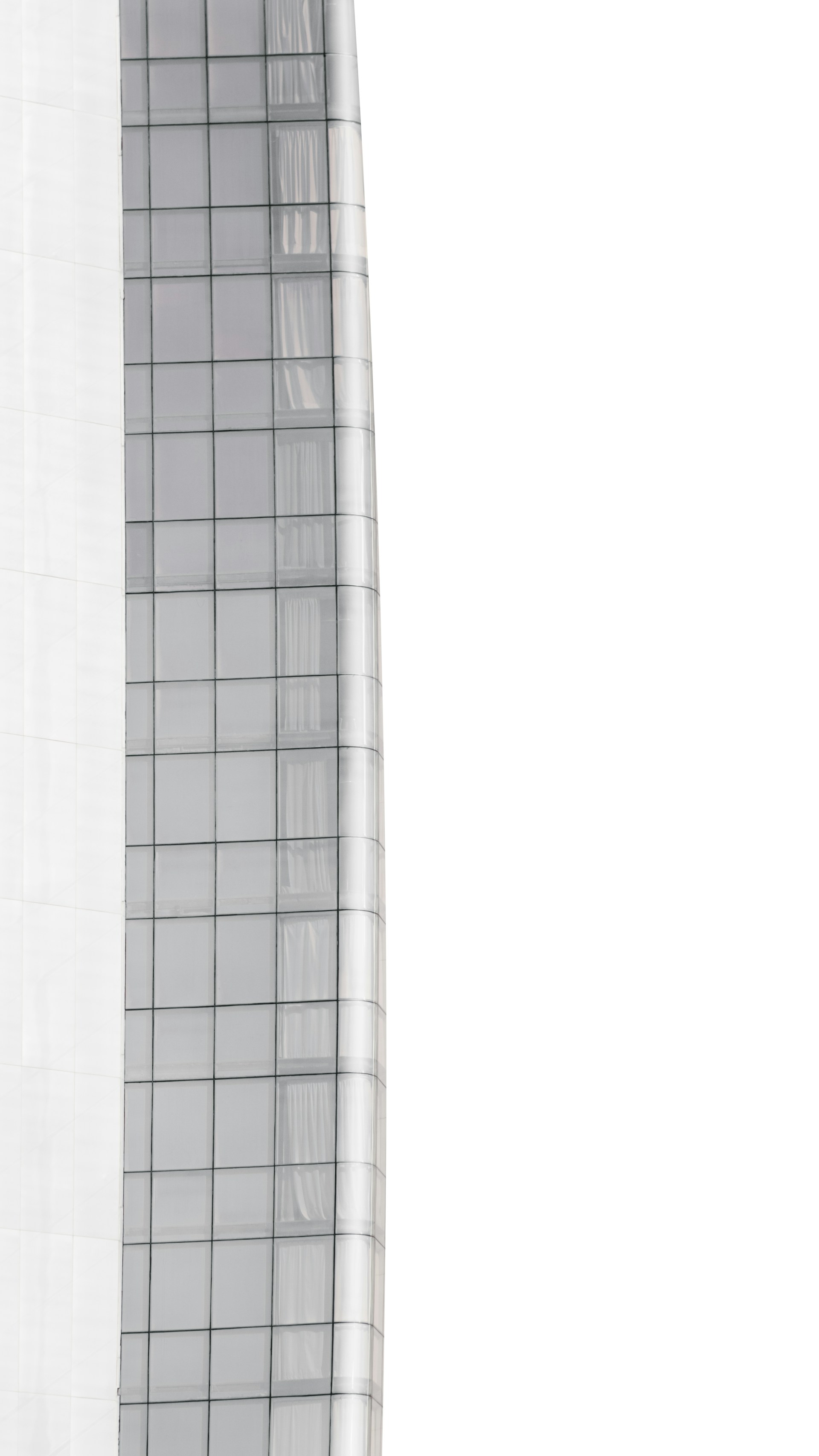 Close-up cinematic frame of a high-end commercial building facade with sleek lines.