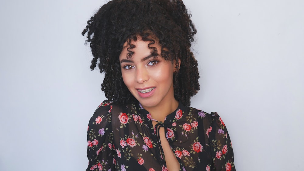 woman in black and red floral button up shirt