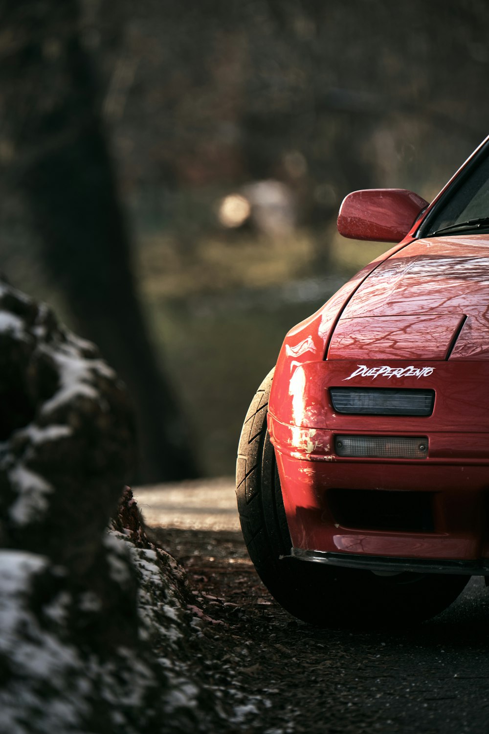 red honda car on road during daytime