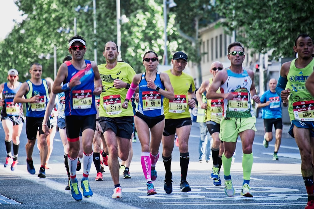 group of people running on the street