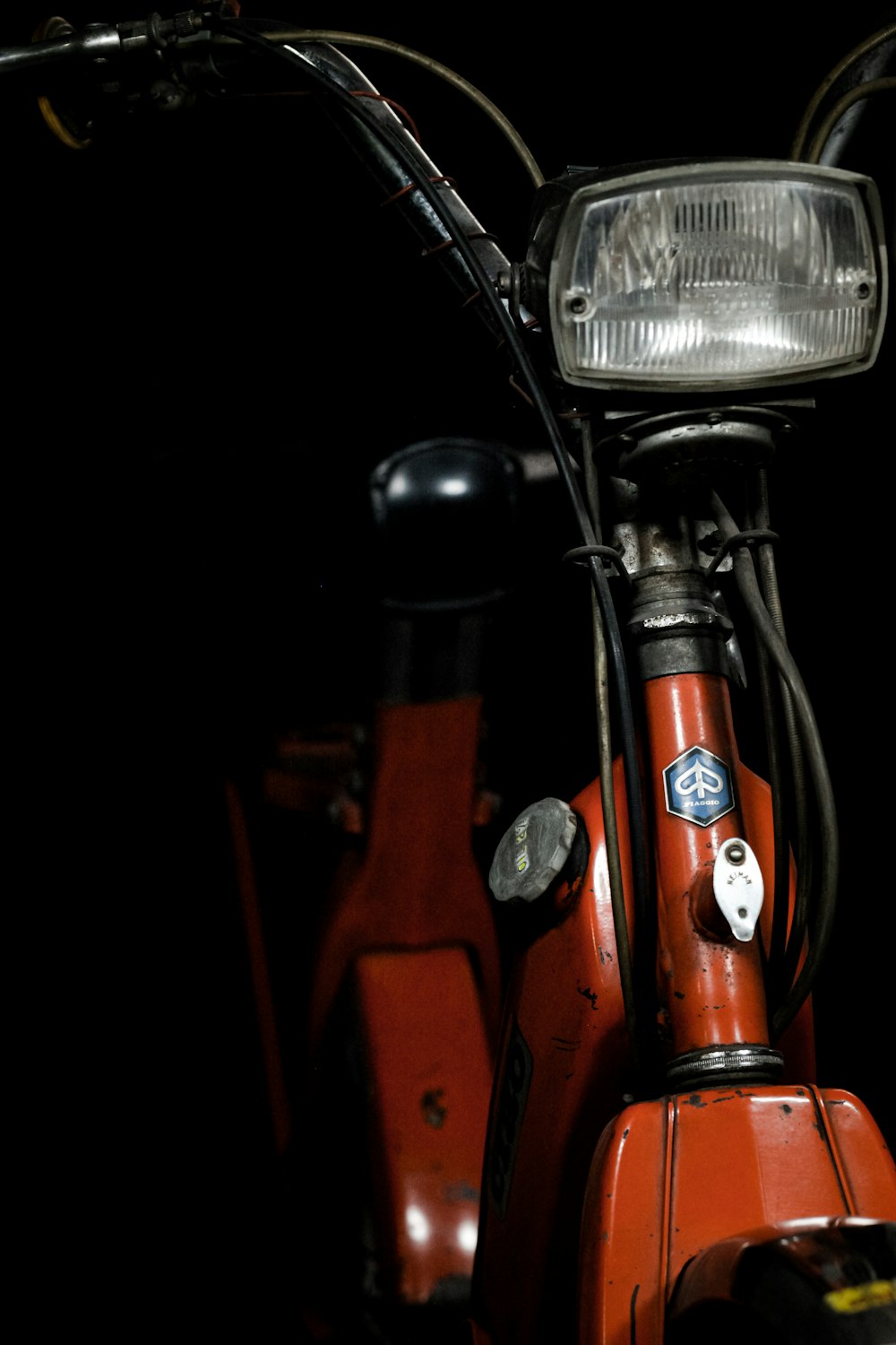 red and black motorcycle in close up photography