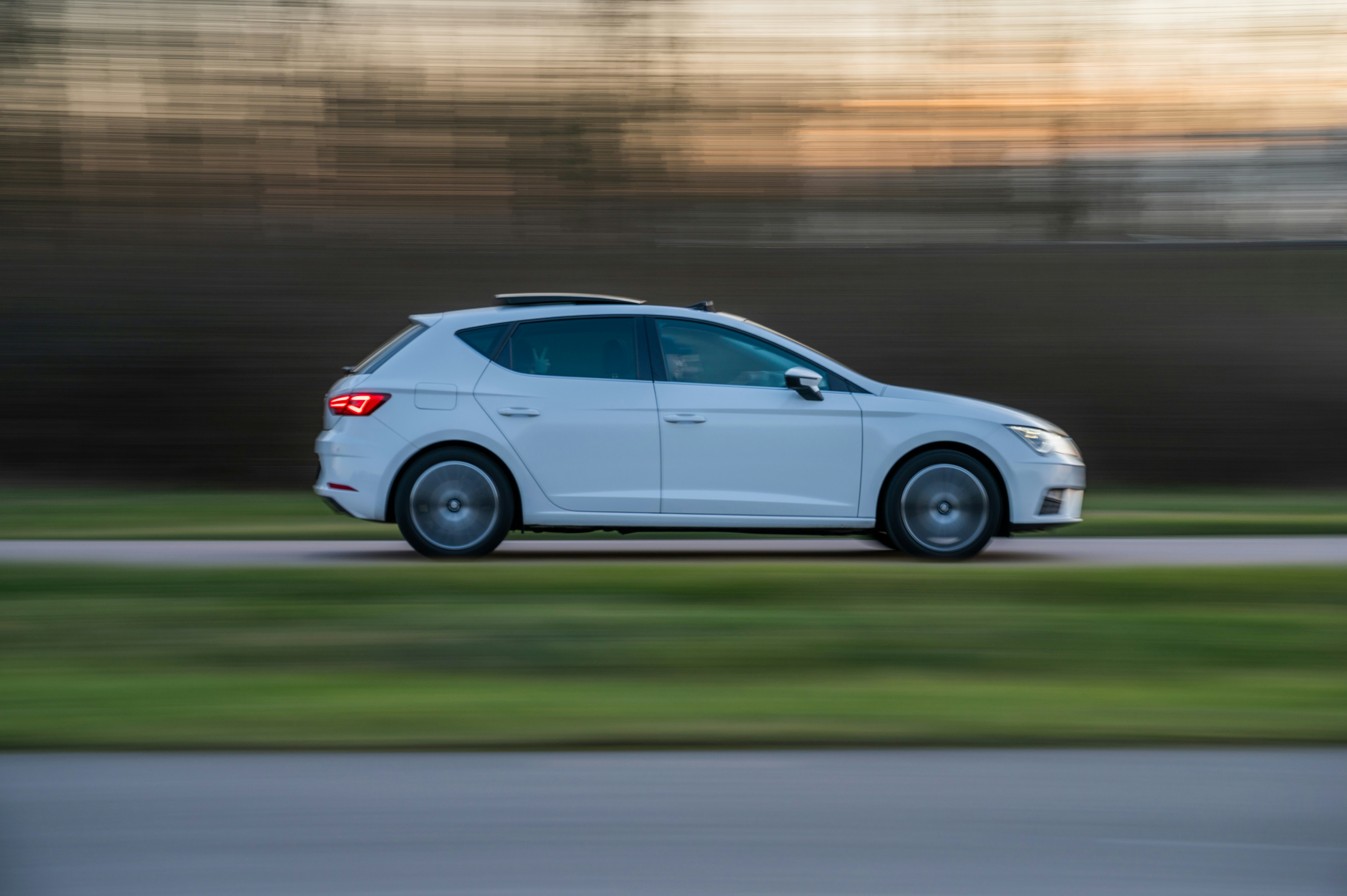 white 5 door hatchback on road during daytime