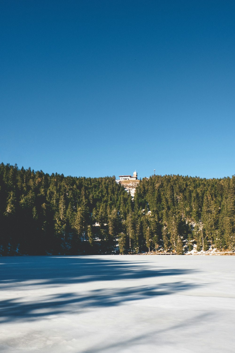 white house in the middle of snow covered field