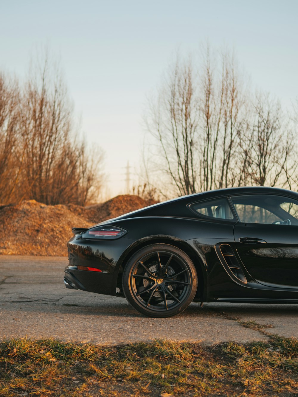 black porsche 911 parked on road during daytime