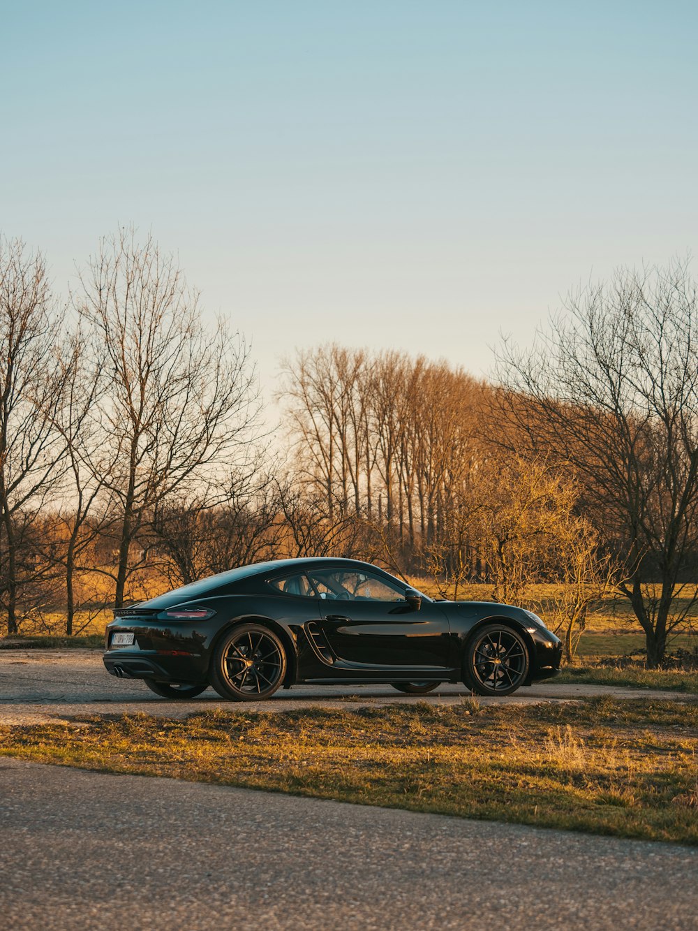 black porsche 911 on road during daytime