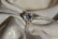 Elegant diamond ring resting on a velvet cushion, highlighting its IGI certification tag.