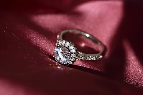 Silver halo ring with round centre stone