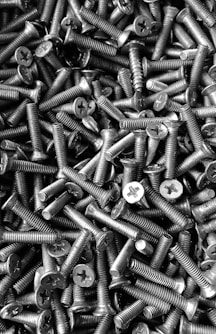 silver screw lot on brown wooden table