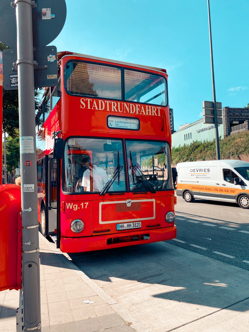 red double decker bus on road during daytime