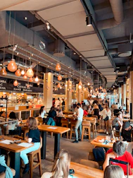A comfortable dining area filled with families enjoying their meals together.