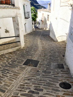 Quaint cobblestone street winding through the traditional village near Cyprus Haven.