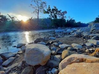Sunset over a peaceful river surrounded by lush trees in Putnam County.