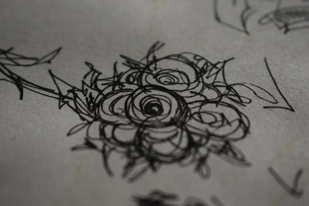 A detailed close-up of a vibrant hand-drawn sketch on textured paper.