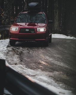 A family enjoying a winter road trip with a Frostguard sticker on their car.