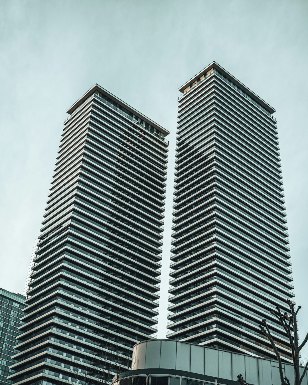 gray concrete building under white clouds during daytime