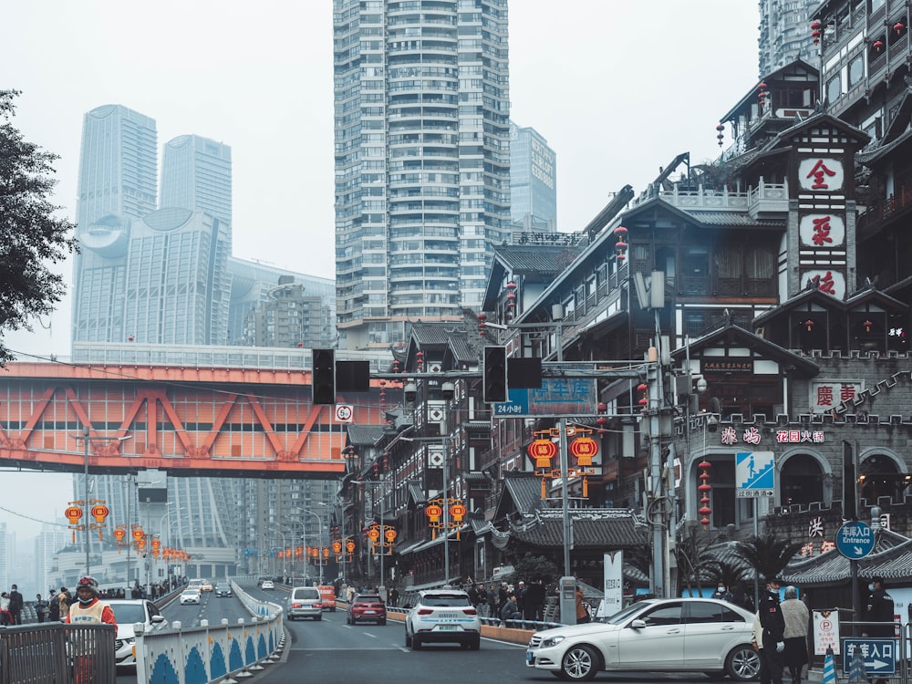 cars on road near buildings during daytime