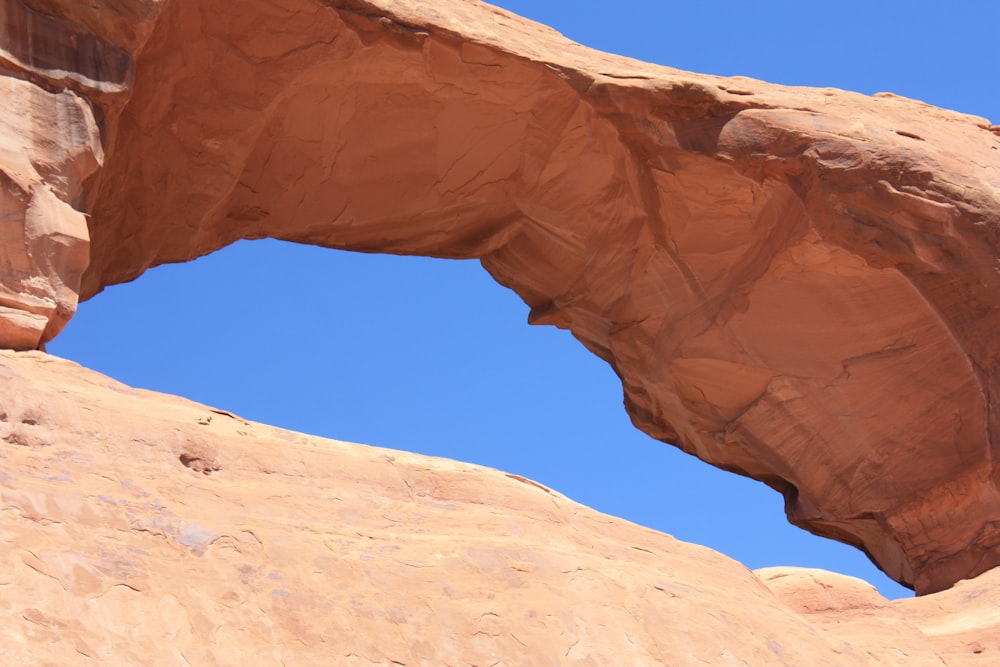 brown rock formation under blue sky during daytime