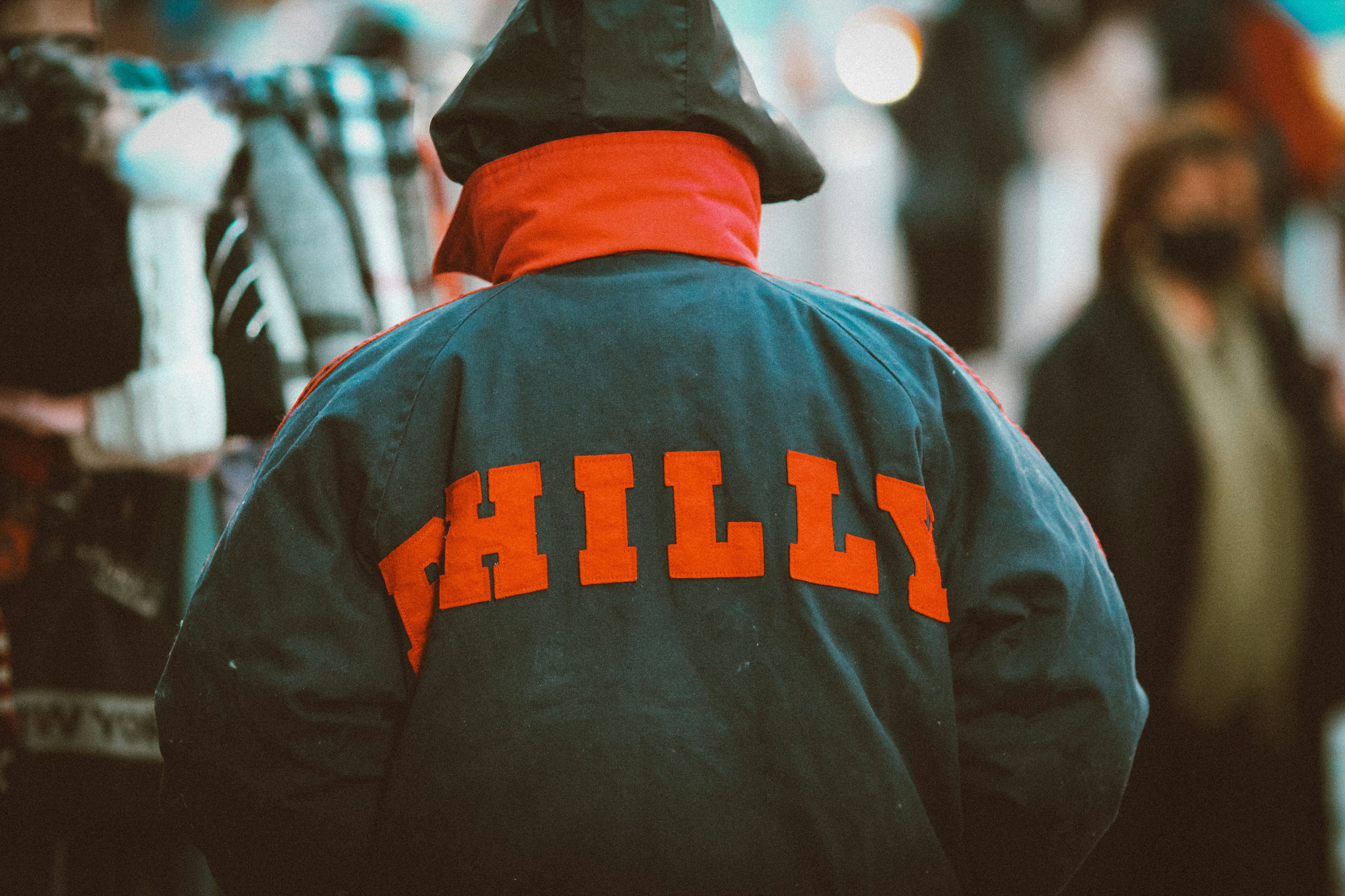man in black and orange hoodie